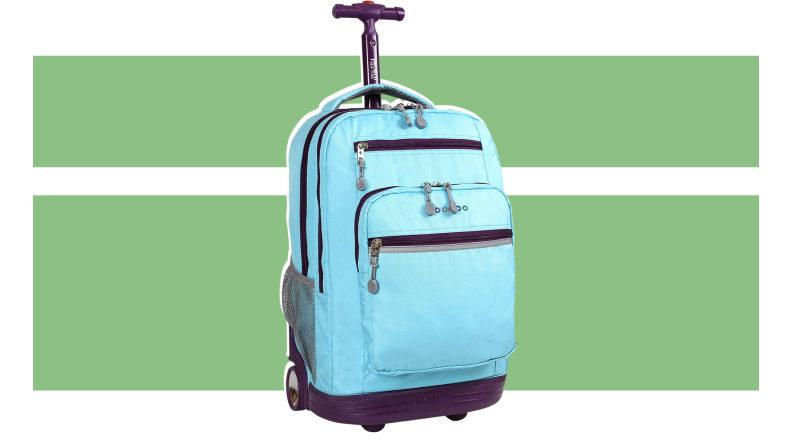 The J World New York Sundance Rolling backpack on a green background.