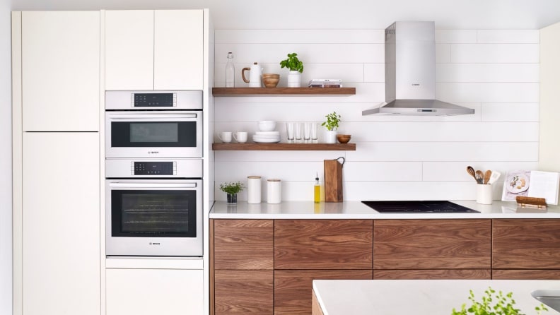A lifestyle image of a sleek, modern kitchen featuring a double wall oven.