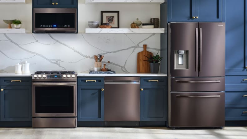 dark gray appliances in kitchen with blue walls