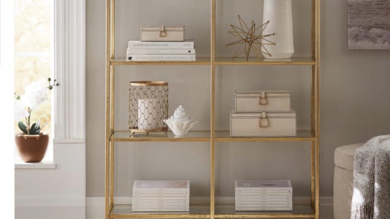 An Eliza aged gold bookcase