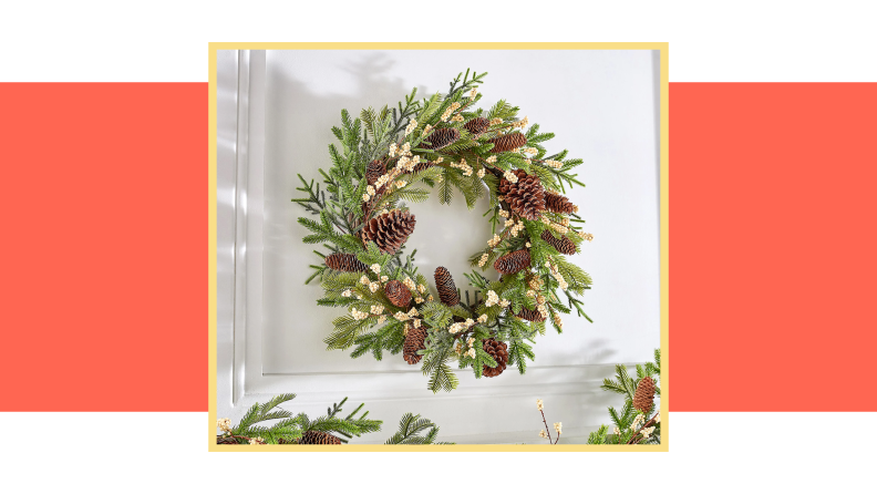 An image of a holiday wreath with pine cones.