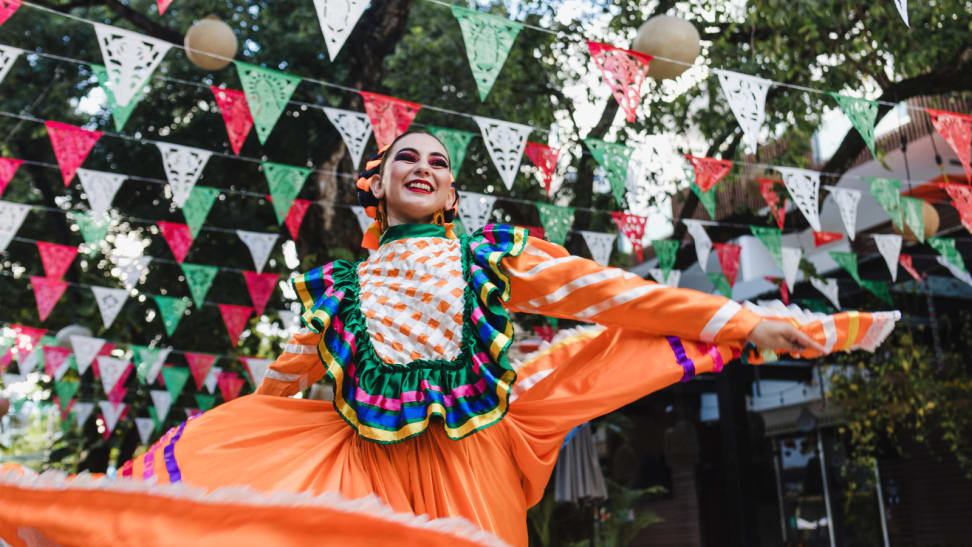 Dancer dancing for Cindo de Mayo while wearing traditional Mexican dress