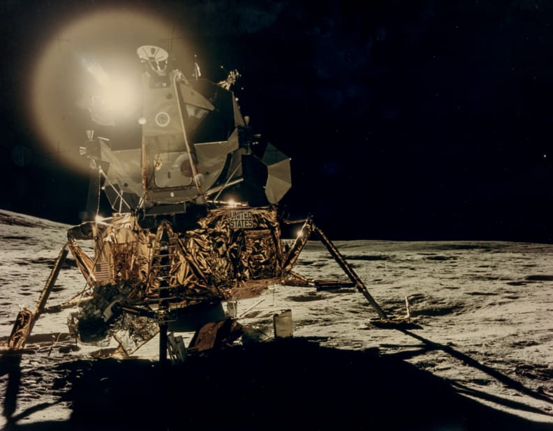Reflections of the Sun over the LM “Antares” in the lunar black sky.