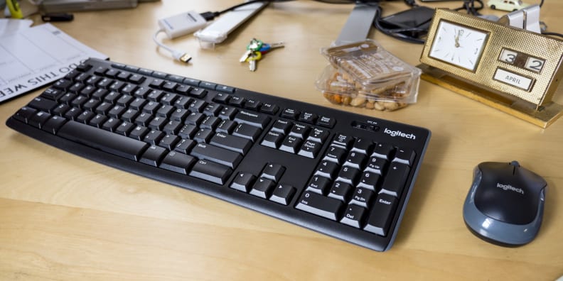 Logitech MK270 wireless mouse and keyboard sitting on a bamboo desk