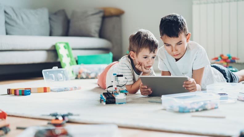 brothers using a tablet together