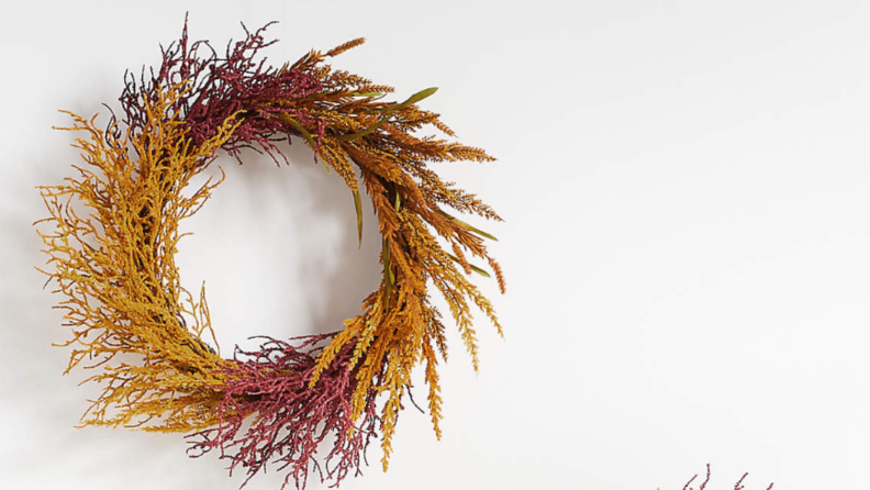 A harvest wreath on a white backdrop