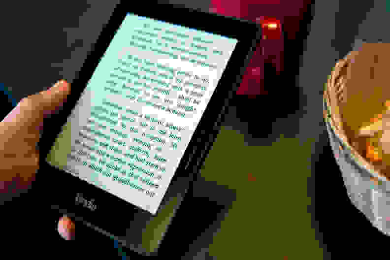A photo of the Amazon Kindle Voyage being held.