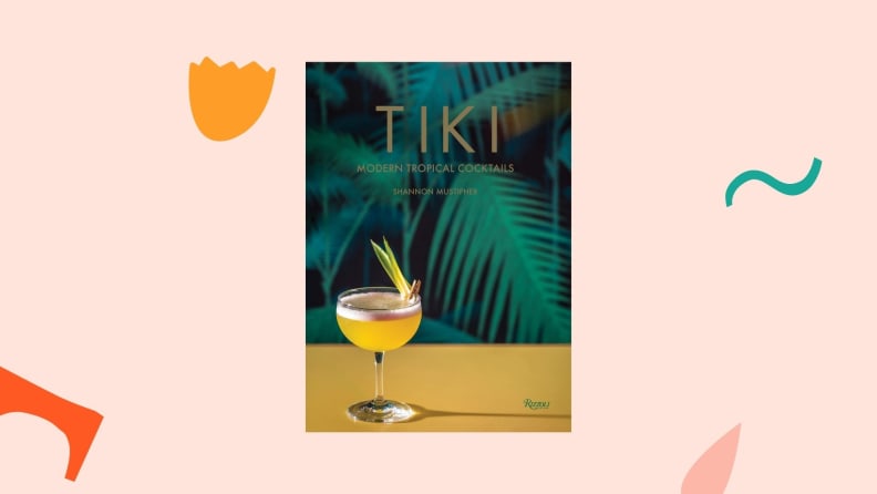 Tiki cookbook against a light pink background.