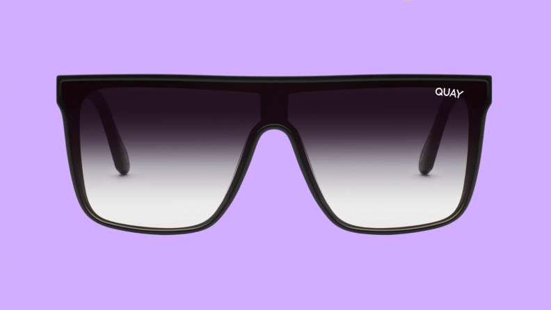 An image of a pair of shield sunglasses in black with black-to-gray lenses.