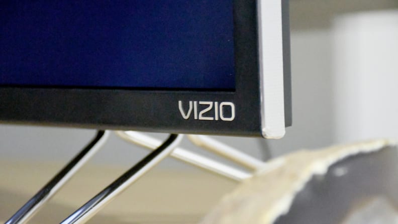 The Vizio M Series features silvery bezels and hollow, wide-set metal feet in a caltrop shape.