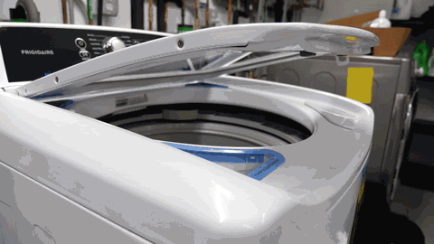 An animated gif of the Frigidaire FFTW4120SW top-loading washer's lid slowly closing.