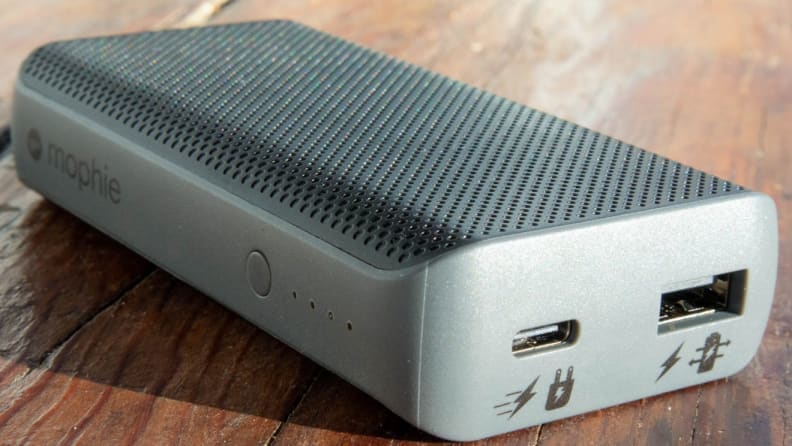 grey portable power bank on wooden table
