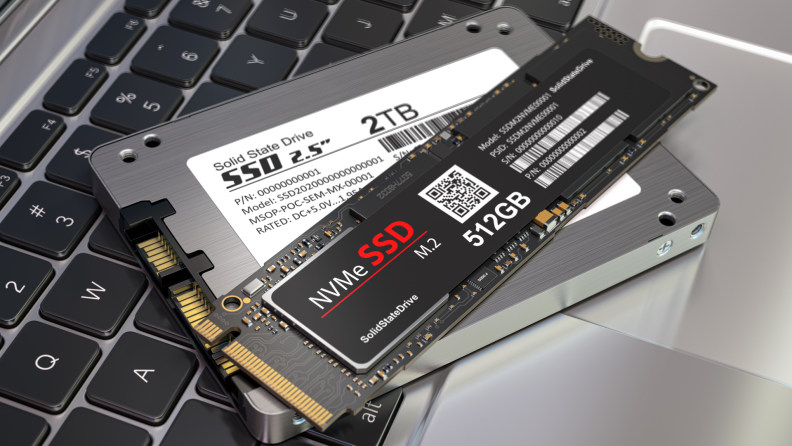 Different types of SSD disk drive isolated on laptop keyboard. Classic SSD and SSD m2. 3d illustration.