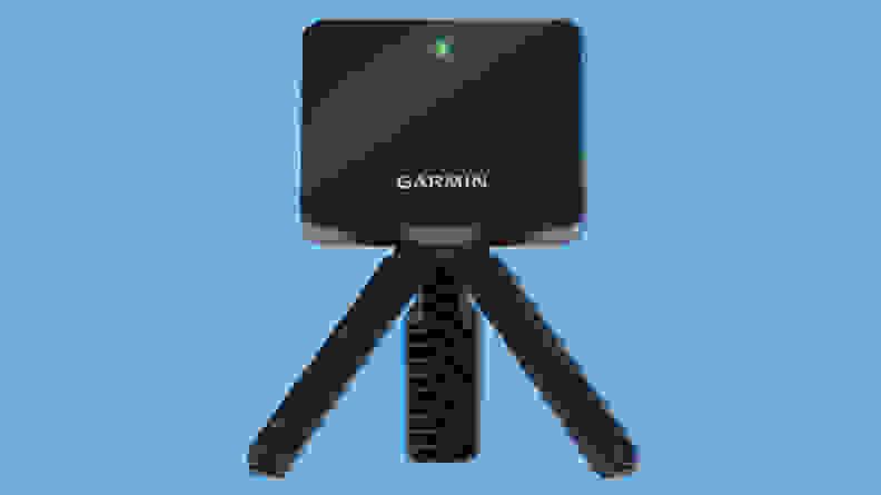 Garmin Approach R10 portable golf launch monitor on a blue background.