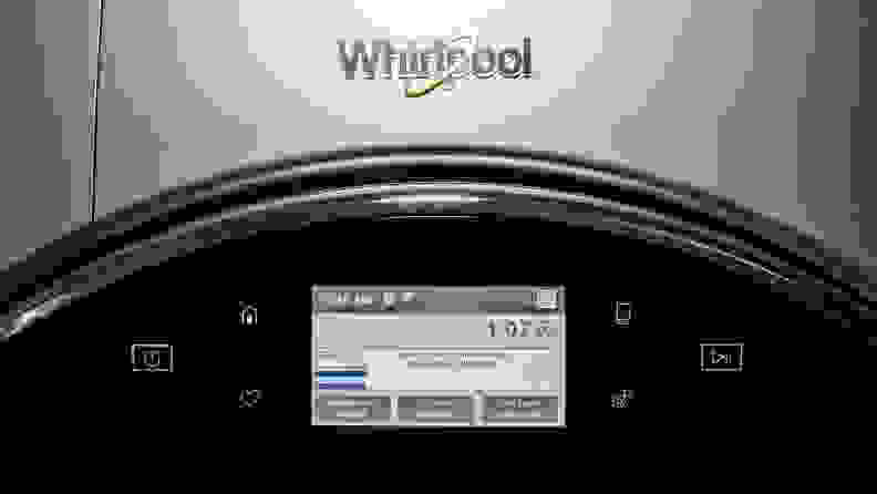 The front of the Whirpool WFW9620HC front-load washing machine; we can see the top part of its door with built-in touchscreen as well as the Whirlpool logo.