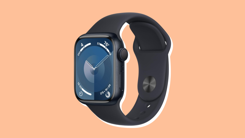 An Apple Watch Series 9 with a black silicone band on an orange background.