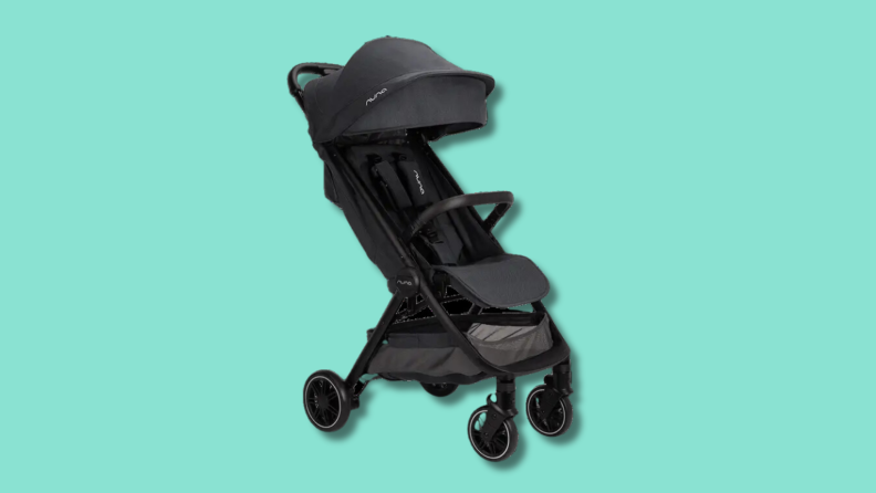 The Nuna Trvl Stroller on a green background.