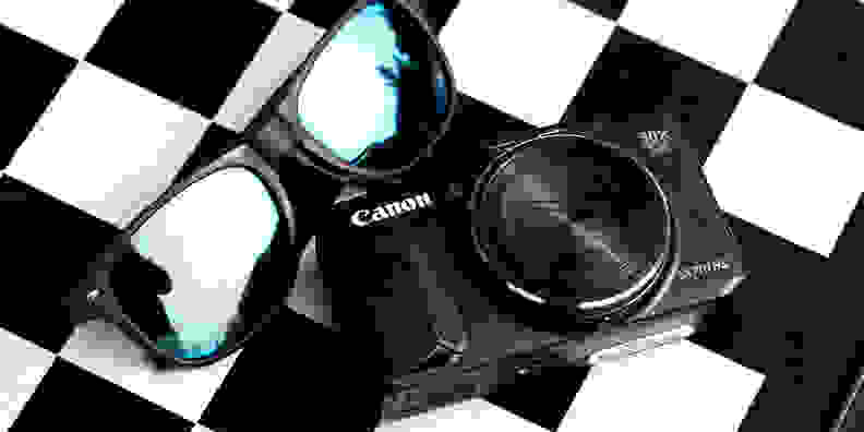 A photo of the Canon PowerShot SX710 HS on a checkerboard