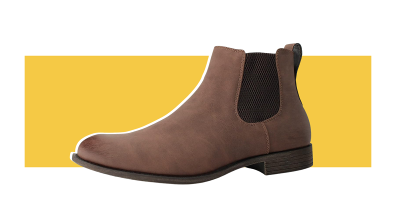 A brown Chelsea boot with black elastic side panels.