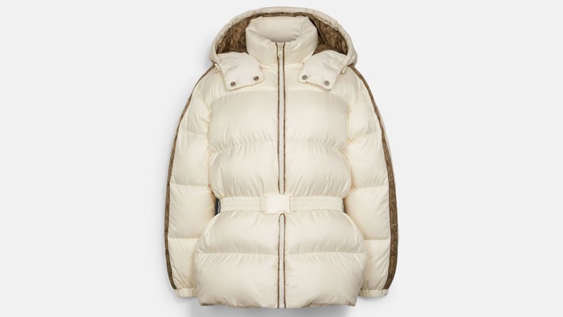 A white puffer coat with a belt, from Coach.