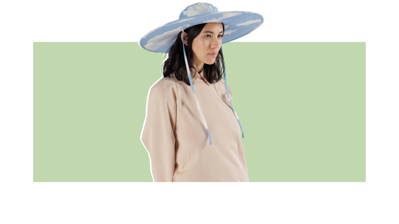 A woman wearing a blue and white sun hat.