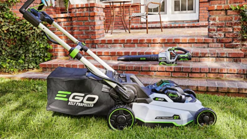 An Ego Power+ electric lawn mower sits on a lawn.