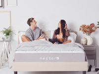 Couple sitting on a Nectar mattress