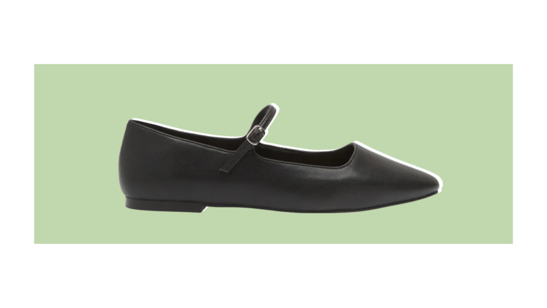 A pair of Mary Jane style shoes with a slightly pointed toe.