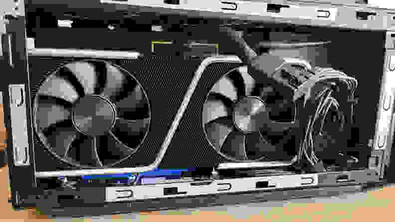 An open desktop PC case showing a graphics card