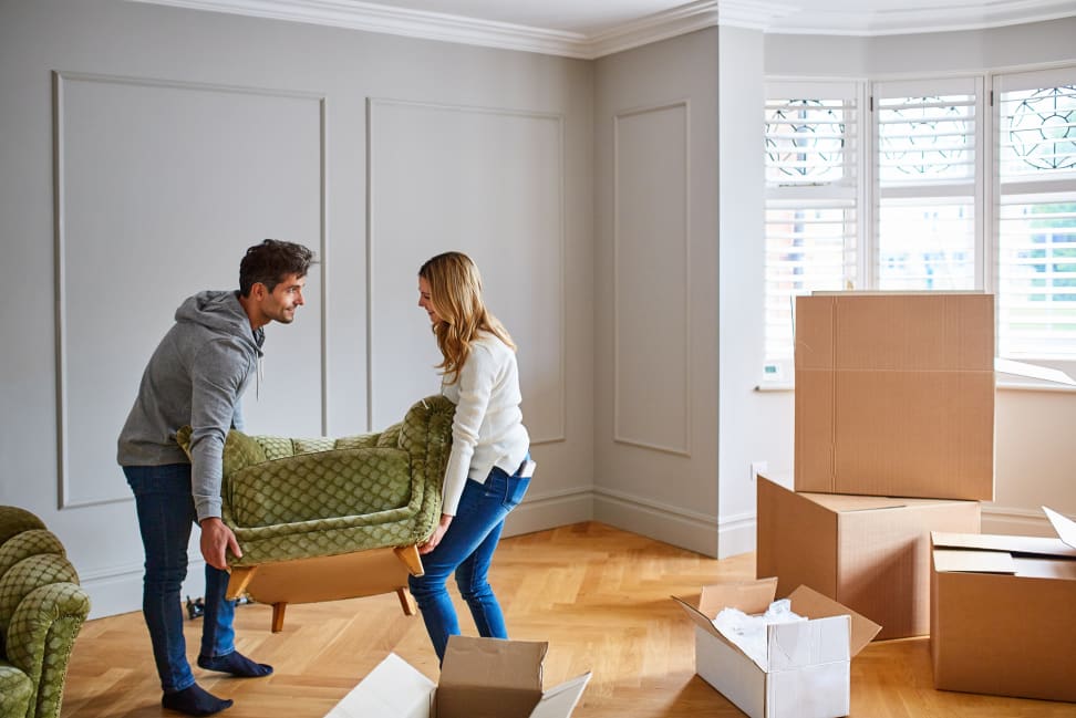 Two people moving in and renovating their home.