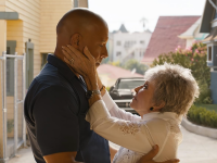An image of Vin Diesel as Dom in 'Fast X' getting spoken to and embraced by Rita Moreno as Abuelita Toretto.