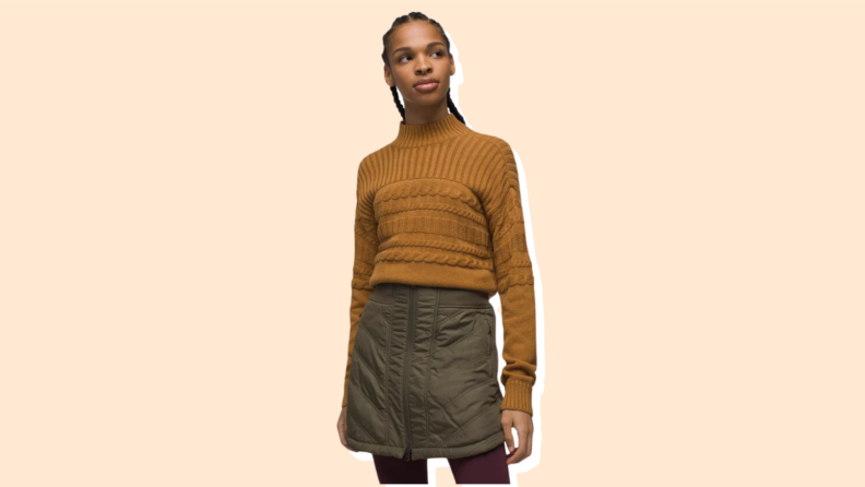 A model wears a brown puffer skirt.