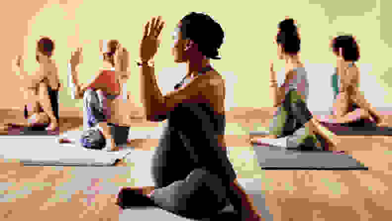 a group stretching in a yoga class