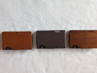 Three wallets against a white background.