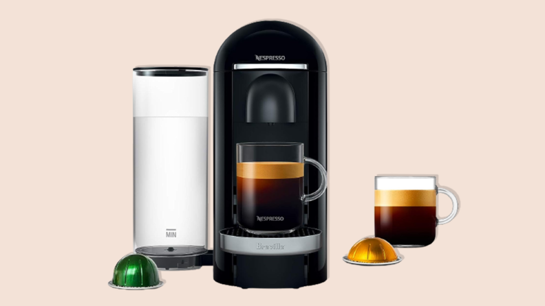 Nespresso VertuoPlus Deluxe Coffee and Espresso Machine on a tan background.