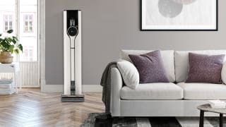 The LG CordZero A939KBGS cordless vacuum stands in its base in a living room