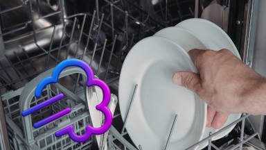 a puff of air drying a white plate inside a dishwasher