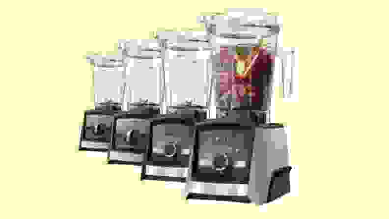Several blenders lined up on a yellow background
