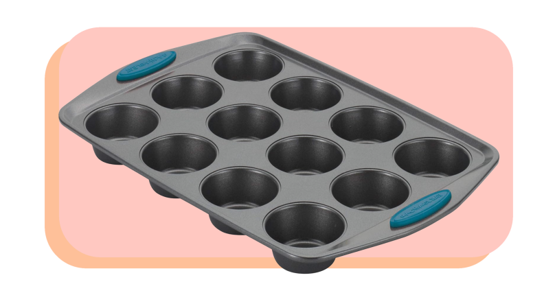 Muffin pan with blue handles on both sides.