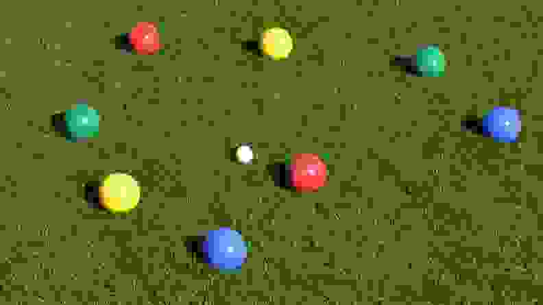 Close up of colorful boccee balls on a lawn.