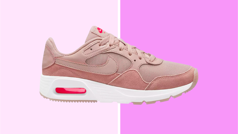 An image of a pale pink Nike SC Running shoe with white soles.