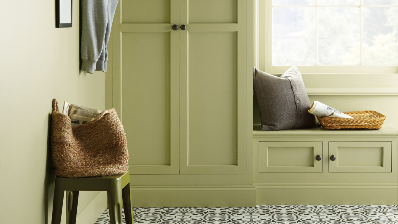 A mudroom with walls painted in Behr Back to Nature