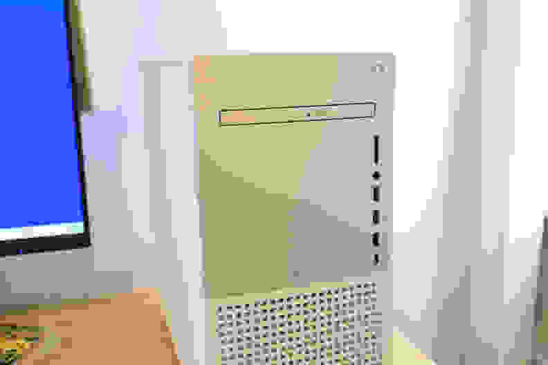 Close up of a DVD disc drive on a white Dell desktop computer tower.
