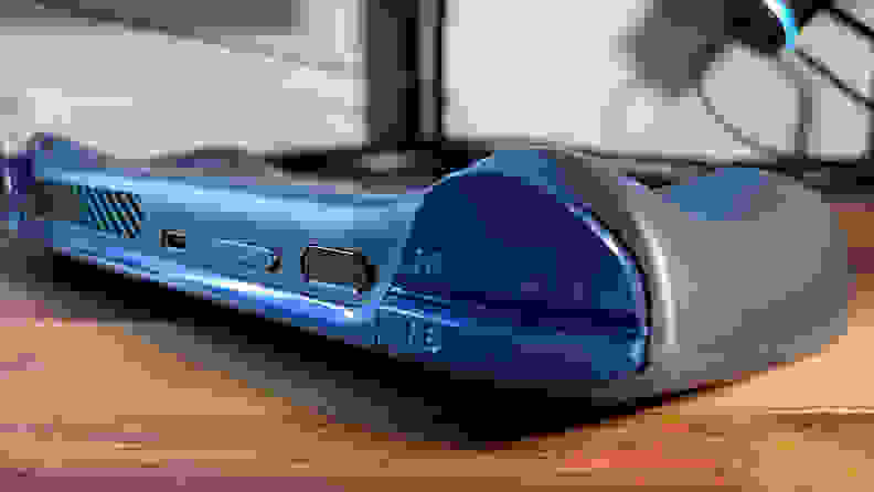 Looking at the rear of a gaming handheld with blue triggers