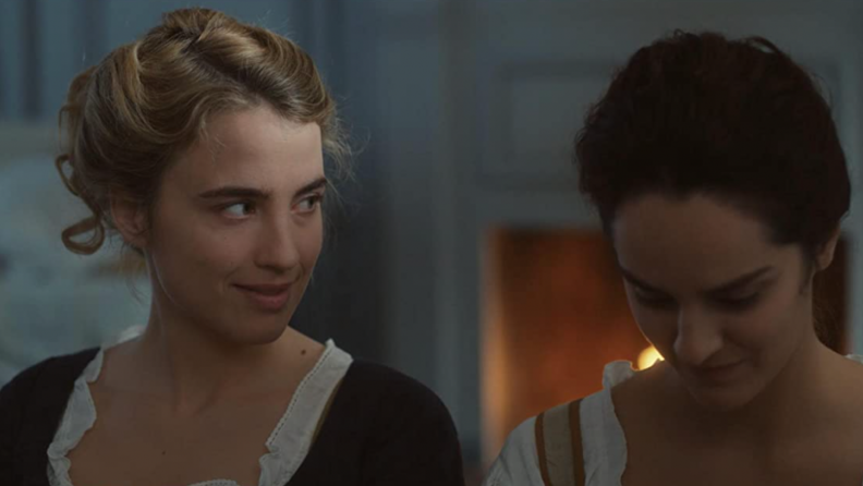 A still from _Portrait of a Lady on Fire_ featuring the main characters looking at one another.