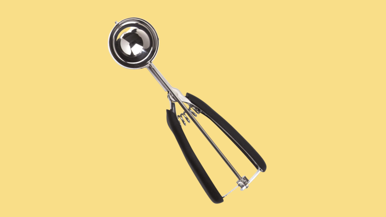 OXO cookie scoop on a yellow background.