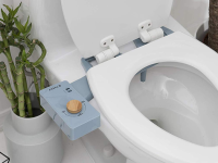 Tushy bidet attachment on white toilet