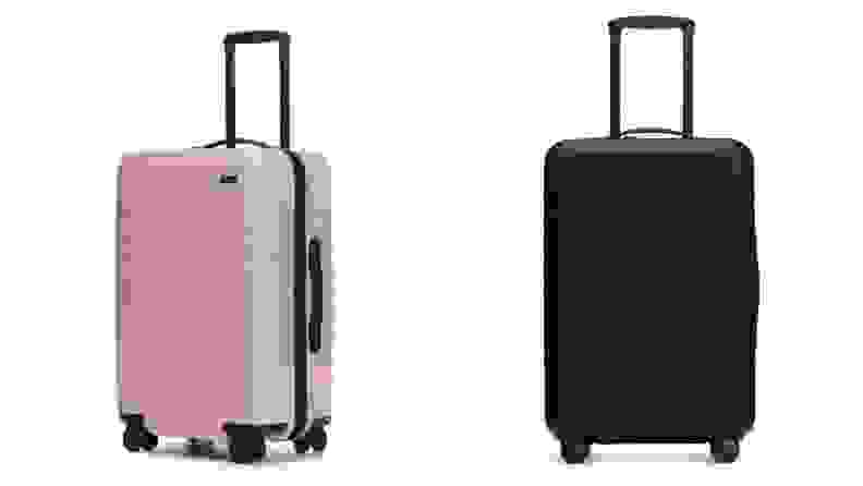 A pink roller bag and a dark blue roller bag