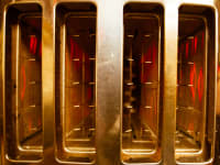 Photo of a 4-Slice toaster turned on.