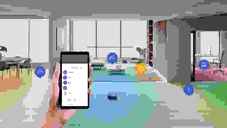 A hand holding a phone showing the MyDyson app with a living room, home office, and dining room in the background.